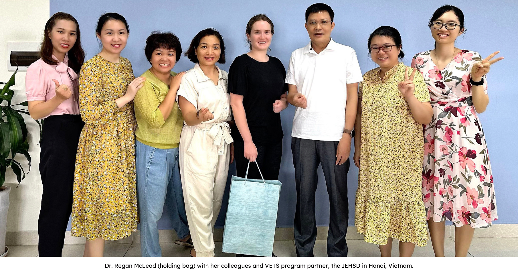 Dr. Regan McLeod (holding bag) with her colleagues and VETS program partner, the IEHSD in Hanoi, Vietnam.